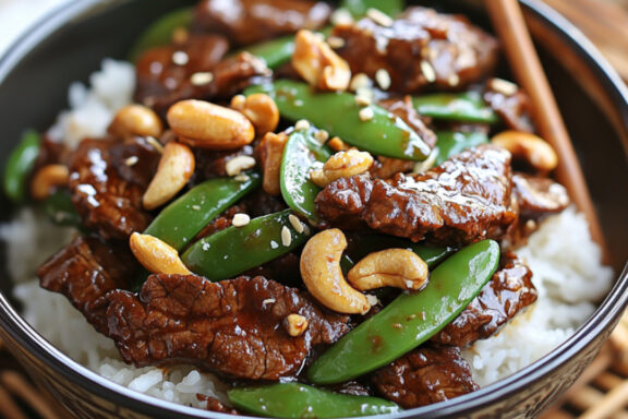 Mongolian Beef with Snow Peas and Cashews in a bowl