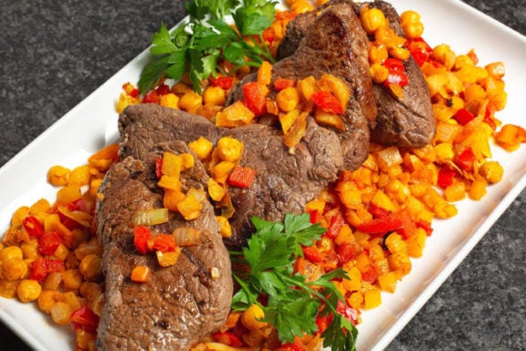 top sirloin steaks with cumin peppers and chickpeas