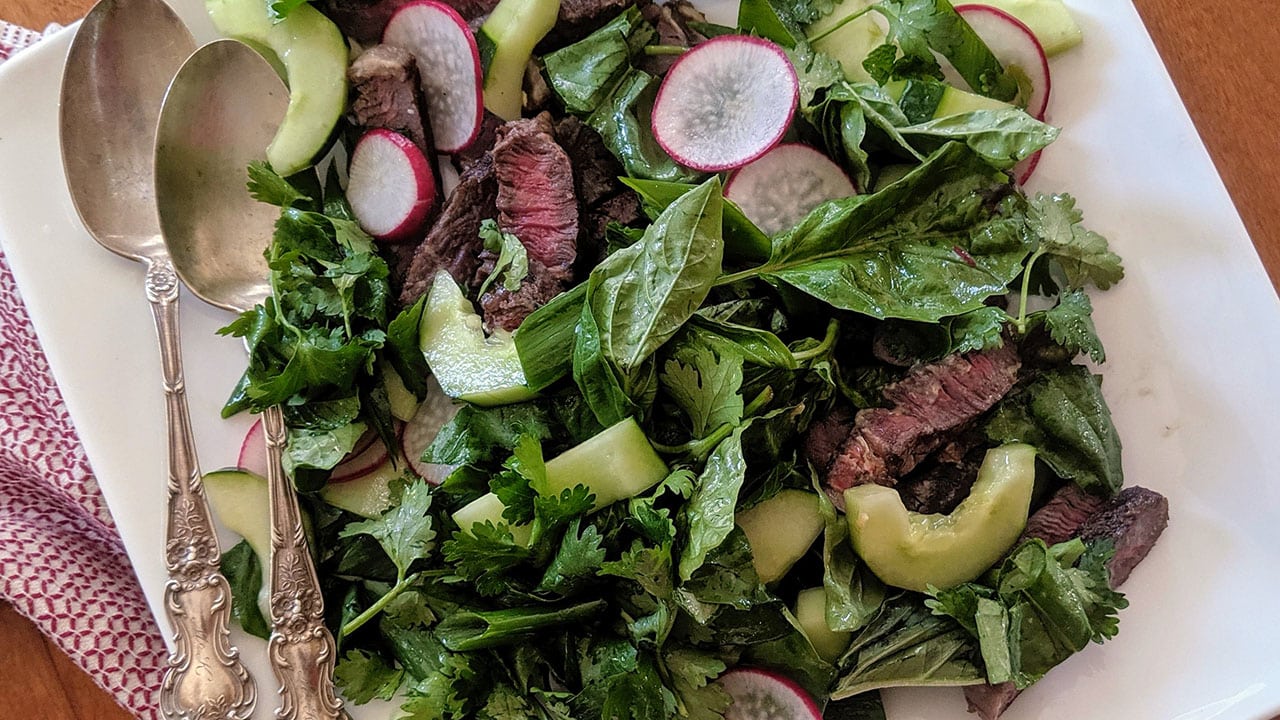 ranch steaks with ginger marinade and cucumbers and radish