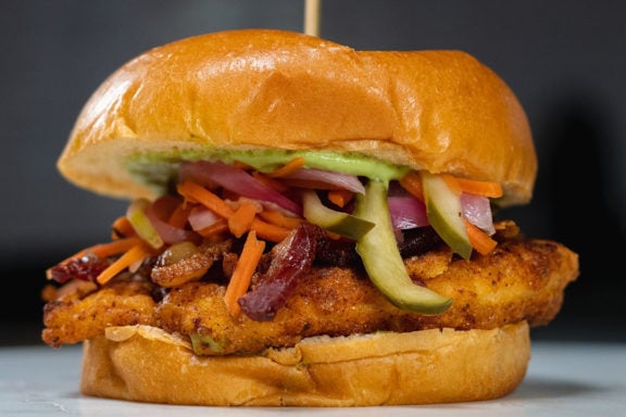 fried chicken sandwich with pickled slaw and avocado mayonnaise