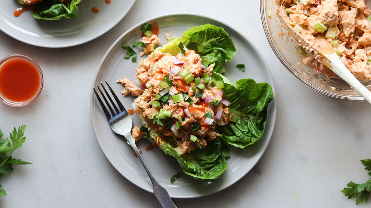 buffalo chicken salad on lettuce leaves