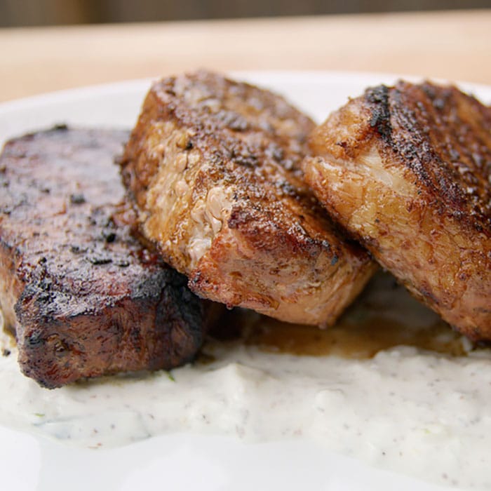 three grilled pork chops