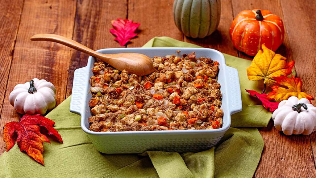 a festive fall table scape with a dish of stuffing 