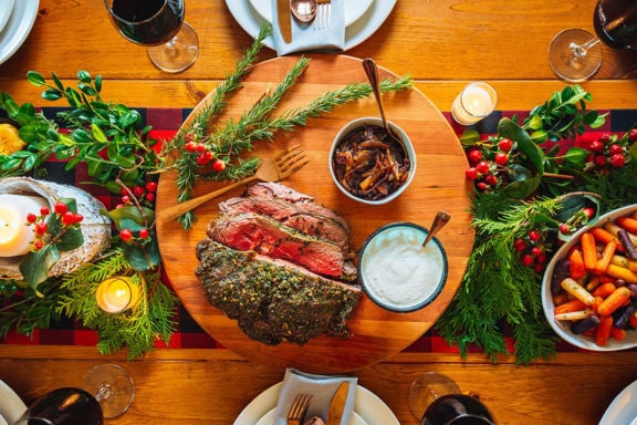 holiday table with delicious slow roasted beef in centerpiece