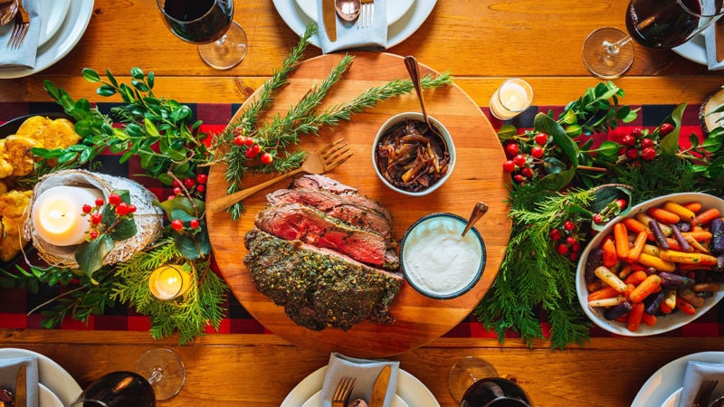 holiday table with delicious slow roasted beef in centerpiece