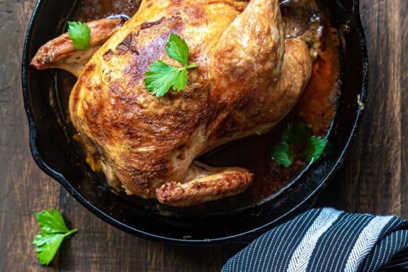 whole chicken in a cast-iron pan