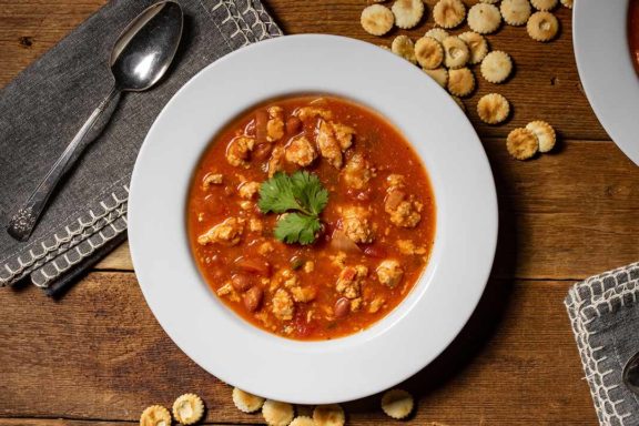 turkey chili in bowl with oyster crackers
