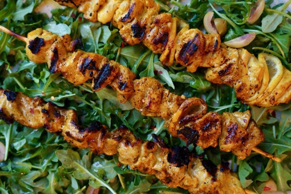 chicken thighs on skewers with lemons