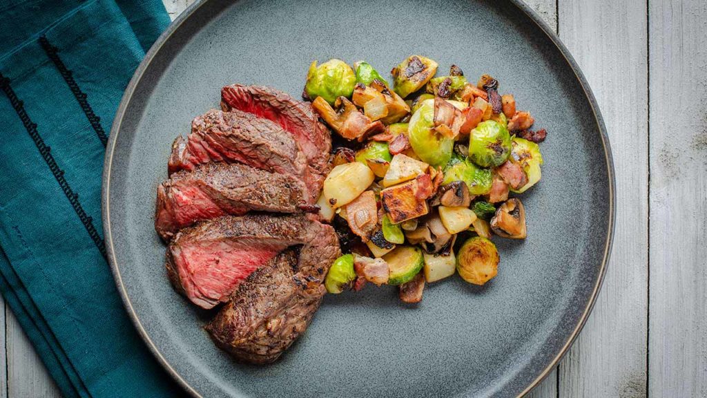 Pan-Seared Top Sirloin Steaks with Bacon and Brussels Sprout Hash