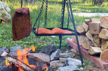 grilling steak chicken and salmon over open fire