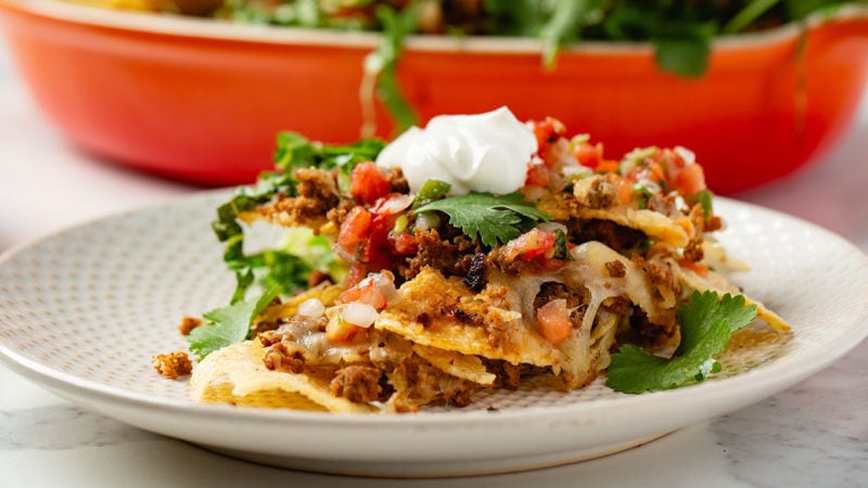 mexican-style chorizo crumbled in between layers of nachos