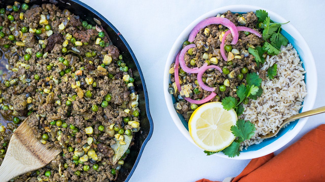 picadillo criollo mixture in a skillet and served in a bowl