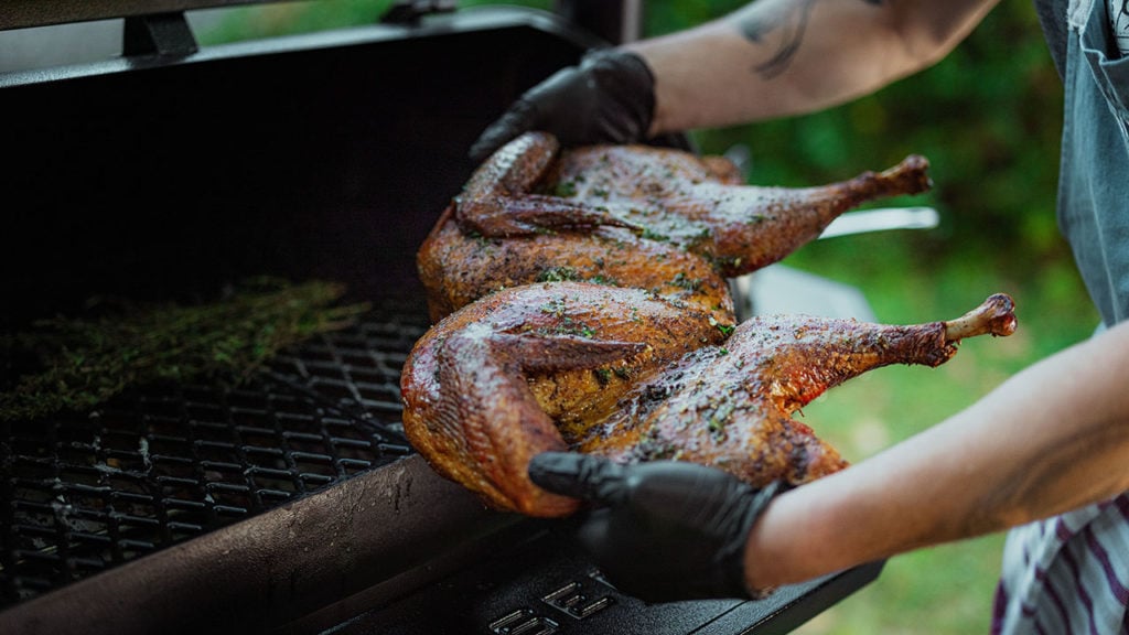 spatchcocking a turkey on a grill