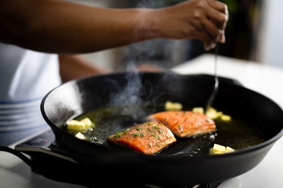 seafood in a cat iron pan with butter