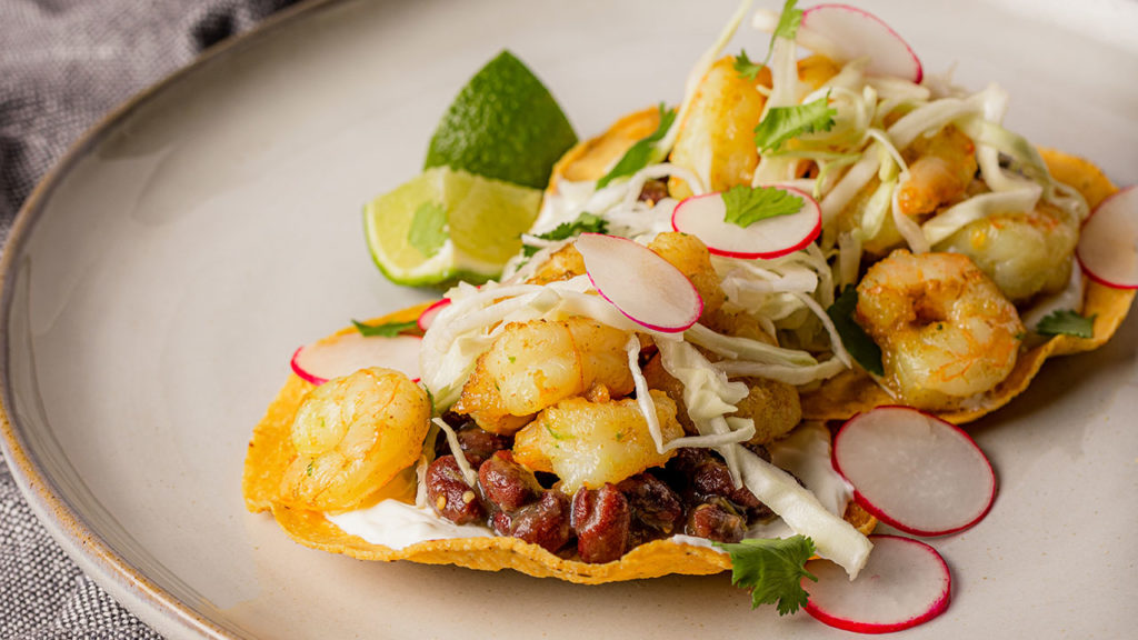 shrimp tostadas with beans and radish cabbage