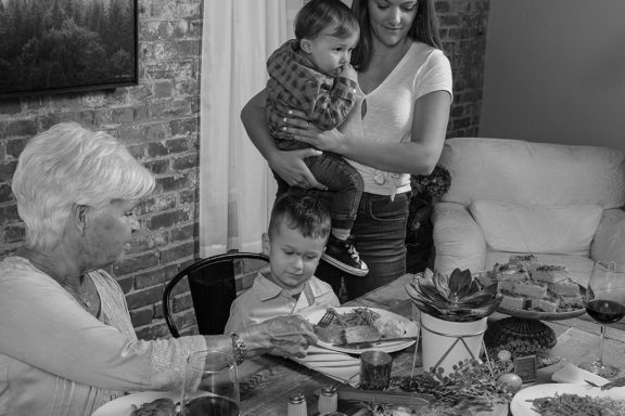 family sitting down at a table together