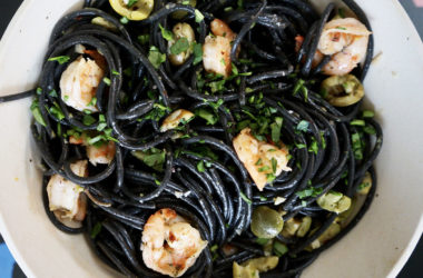 black squid pasta with green olives and shrimp