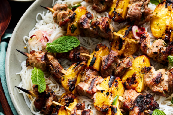 Grilled pork and stone fruit skewers