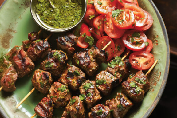 Hariyali Lamb Tikka with Tomato Salad on a plate