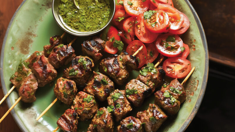 Hariyali Lamb Tikka with Tomato Salad on a plate