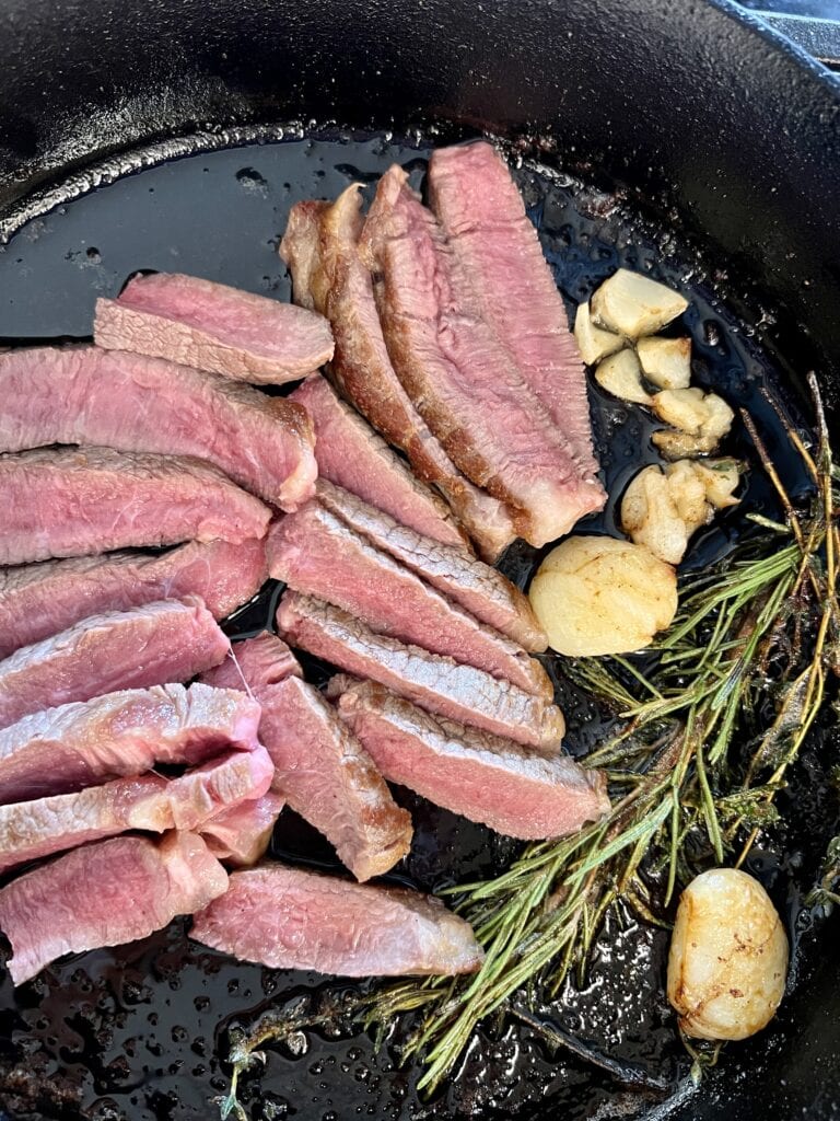 Strip loin in a cast iron skillet