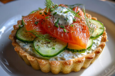 Smoked Sockeye Salmon Tart with Creme Fraiche and Cucumber on a plate