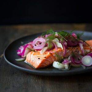 Slow-Roasted Salmon with Pickled Onions and Fennel on a plate