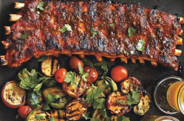 st. louis ribs with veggies in a serving plate