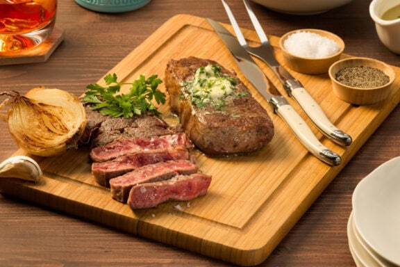 top sirlion steak in a chopping board