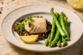 sablefish with asparagus on a plate